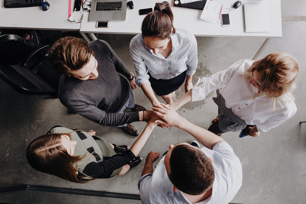Group of employees engaged in a trust building exercise