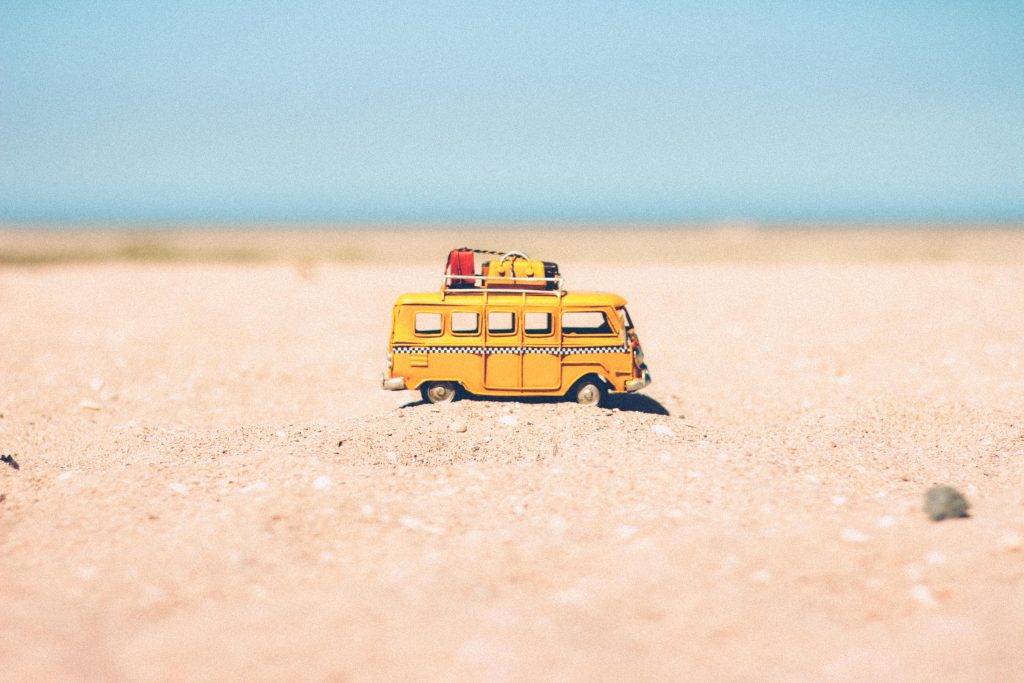 Toy camper van on the beach